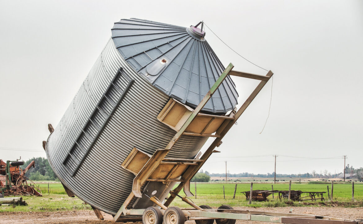 A grain bin being moved