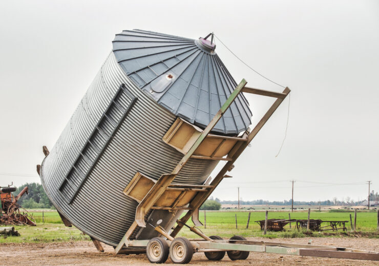 A grain bin being moved