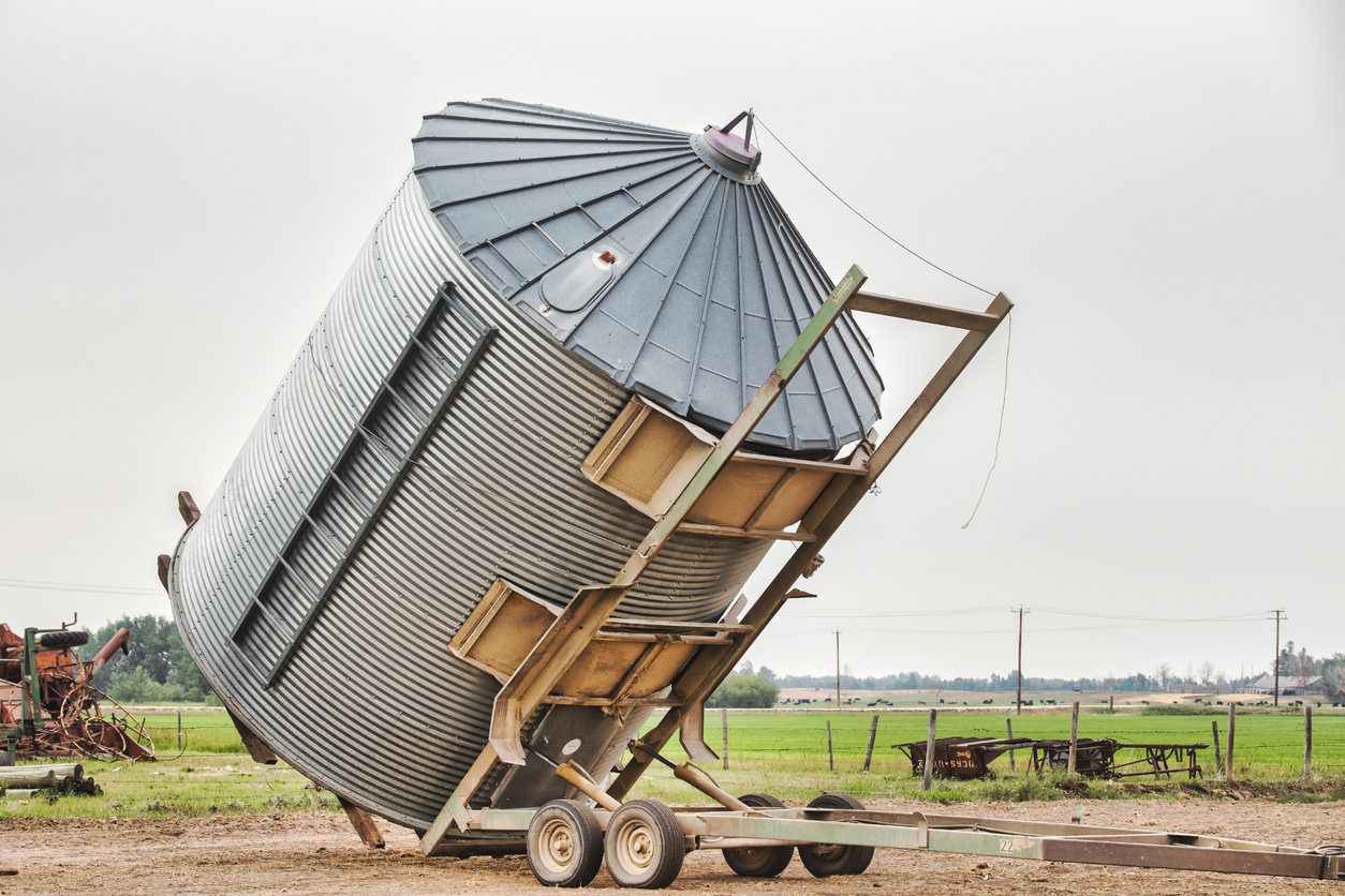 A grain bin being moved