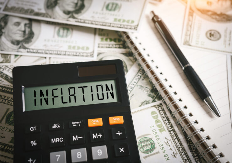 INFLATION word on calculator in idea for FED consider interest rate hike, world economics and inflation control, US dollar inflation