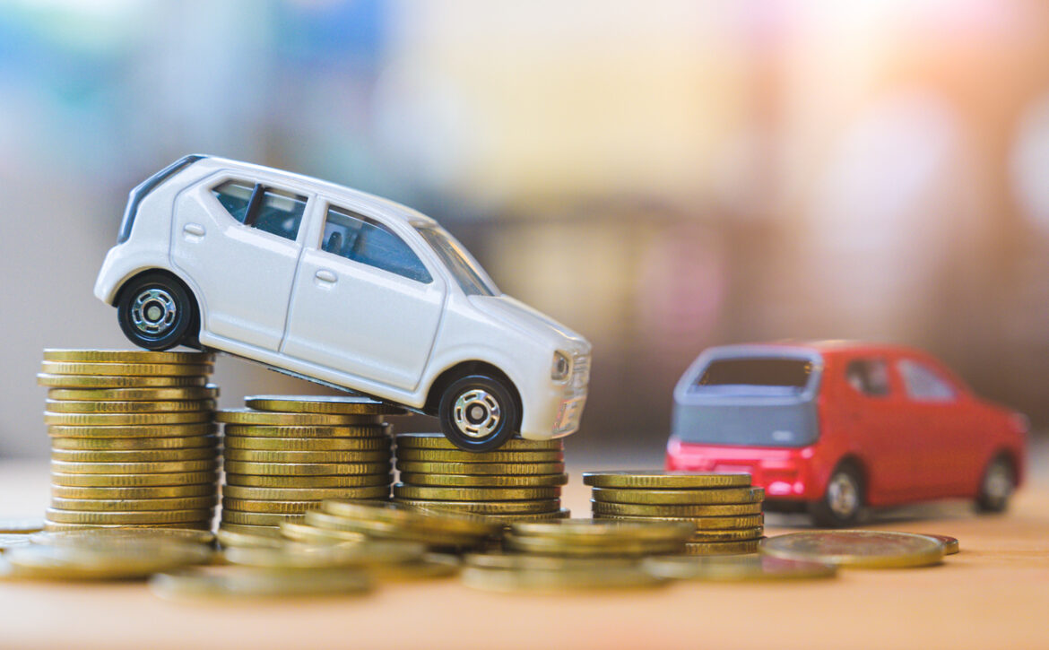 Car and stack of coin. Saving money for car concept. Car finance, buy car new concept.