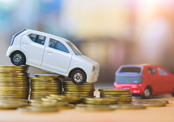 Car and stack of coin. Saving money for car concept. Car finance, buy car new concept.