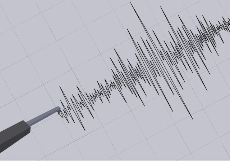 Detailed Graphical Representation of Earthquake Vibrations Captured on a Seismograph against the grid background. Seismograph recording seismic waves. Vector Illustration.