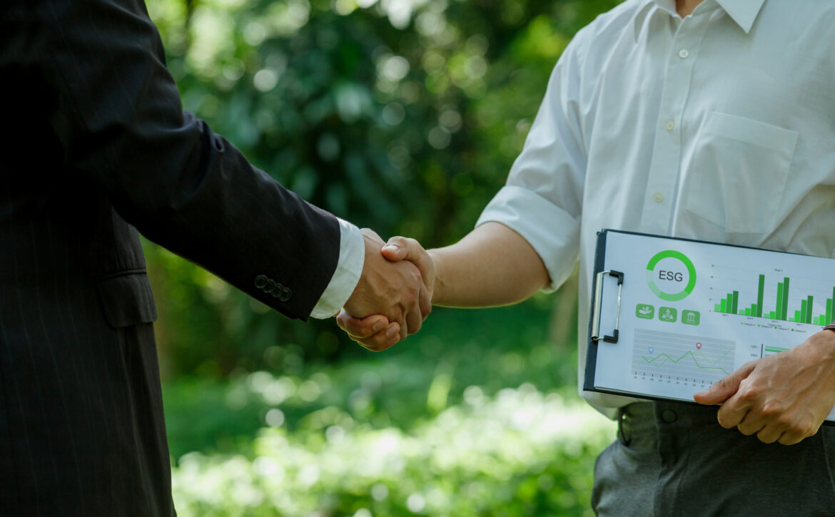 World Environment Day.ESG. business partner colleagues shaking hands working together in sustainable development goal. Sustainable business.Business value chain and Growing sustainability.CSR.