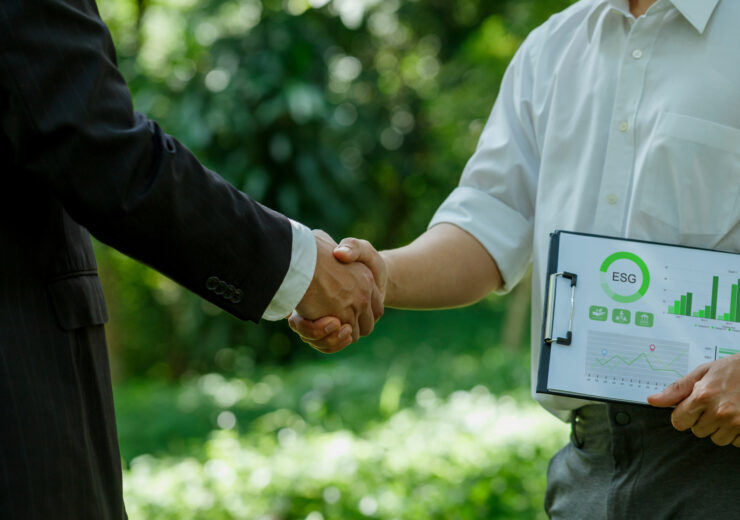 World Environment Day.ESG. business partner colleagues shaking hands working together in sustainable development goal. Sustainable business.Business value chain and Growing sustainability.CSR.