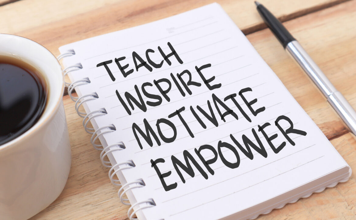 Teach inspire motivate empower, text words typography written on paper against wooden background, life and business motivational inspirational